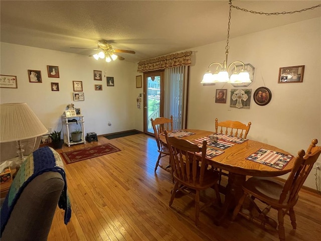 95 W Lakeview Dr, De Soto, MO 63020 - dining area featuring a chandelier, wood-type flooring, and a ceiling fan