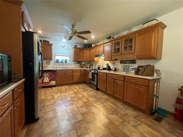 95 W Lakeview Dr, De Soto, MO 63020 - kitchen featuring stainless steel appliances, under cabinet range hood, a sink, brown cabinets, and a ceiling fan