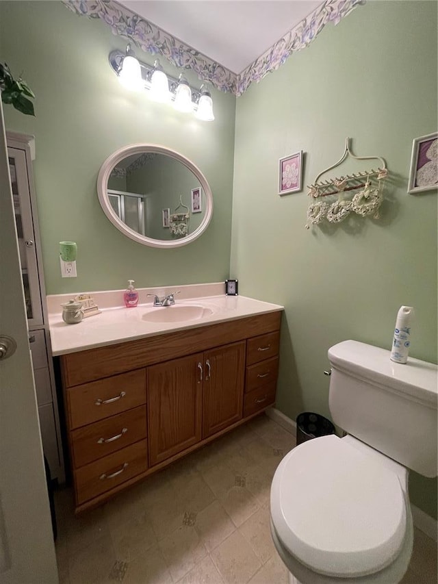 95 W Lakeview Dr, De Soto, MO 63020 - bathroom featuring vanity, toilet, and tile patterned flooring