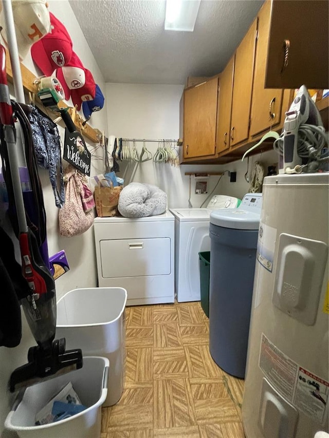 95 W Lakeview Dr, De Soto, MO 63020 - laundry area featuring cabinet space, electric water heater, washer and clothes dryer, a textured ceiling, and light floors