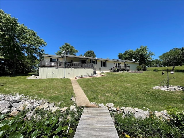 95 W Lakeview Dr, De Soto, MO 63020 - back of property featuring a wooden deck and a yard