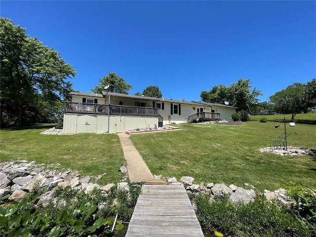 95 W Lakeview Dr, De Soto, MO 63020 - back of property featuring a wooden deck and a lawn