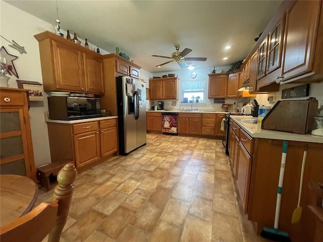 95 W Lakeview Dr, De Soto, MO 63020 - kitchen with stainless steel fridge with ice dispenser, black microwave, a sink, a ceiling fan, and light countertops