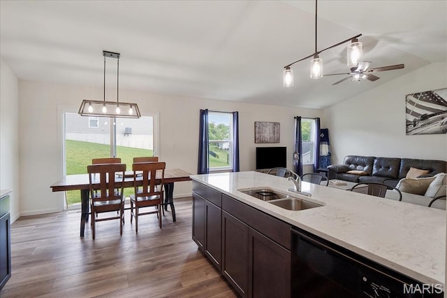800 Boulder Crest Ct, Eureka, MO 63025 - kitchen featuring black dishwasher, a sink, open floor plan, wood finished floors, and lofted ceiling
