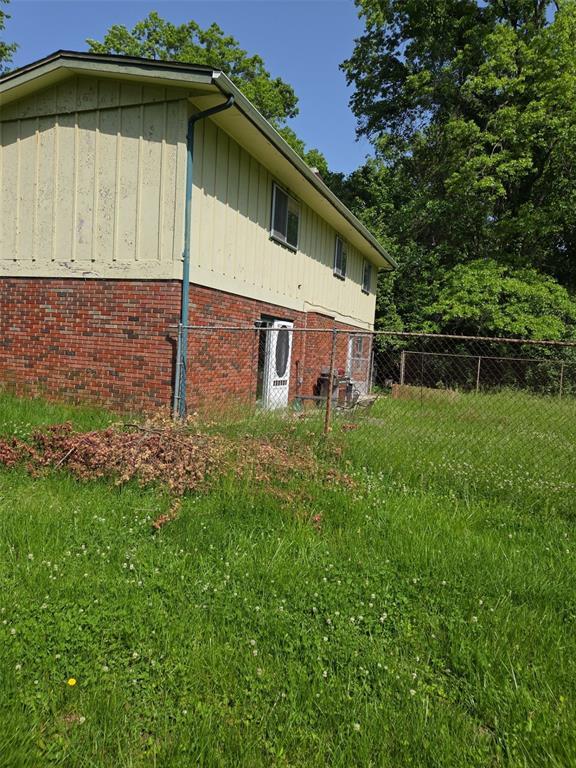 125 Country Club Pl, Belleville, IL 62223 - view of home's exterior featuring brick siding and board and batten siding
