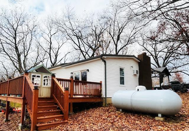 656B Watson Rd, Sullivan, MO 63080 - rear view of property featuring a deck, a chimney, and stairway