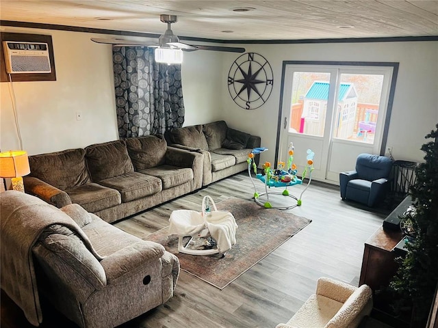 656B Watson Rd, Sullivan, MO 63080 - living room featuring an AC wall unit, healthy amount of natural light, light wood-type flooring, ceiling fan, and crown molding