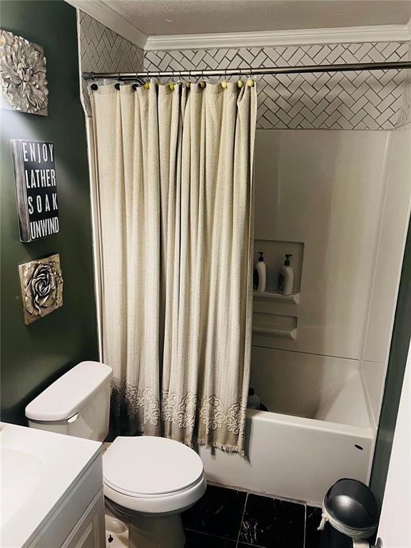 656B Watson Rd, Sullivan, MO 63080 - bathroom featuring ornamental molding, toilet, shower / bath combo, vanity, and marble finish floors