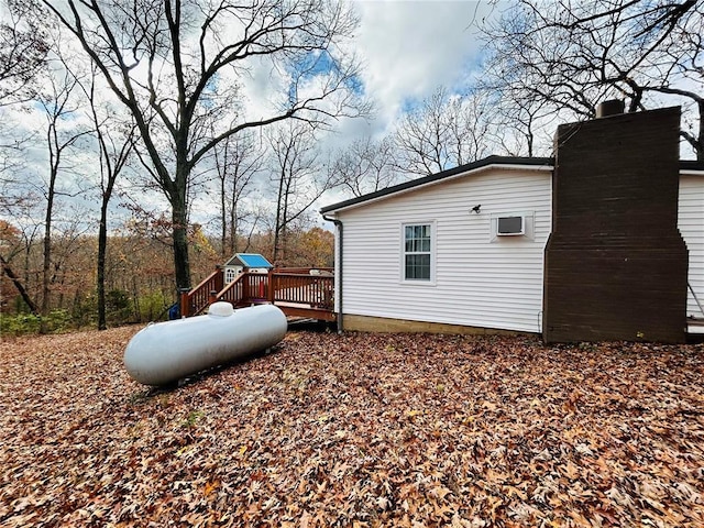 656B Watson Rd, Sullivan, MO 63080 - view of property exterior featuring a wooden deck and a chimney
