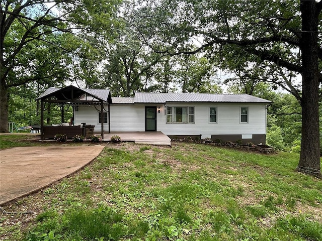 656B Watson Rd, Sullivan, MO 63080 - view of front facade featuring a wooden deck, metal roof, and a front lawn