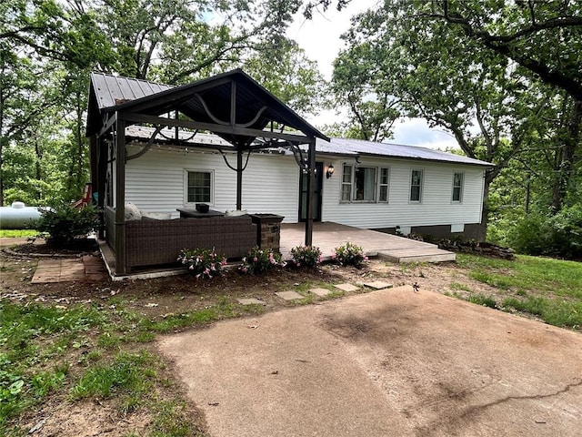 656B Watson Rd, Sullivan, MO 63080 - view of front facade with metal roof and a deck