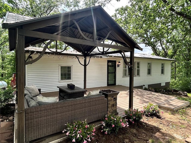 656B Watson Rd, Sullivan, MO 63080 - back of property featuring a wooden deck, an outdoor living space, and metal roof