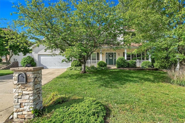 3912 Jacobs Lndg, Saint Charles, MO 63304 - obstructed view of property with driveway, a front lawn, covered porch, and an attached garage
