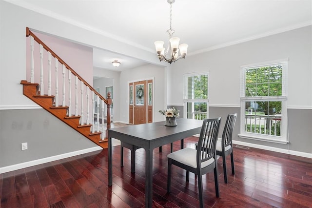 3912 Jacobs Lndg, Saint Charles, MO 63304 - dining room featuring a chandelier, wood finished floors, baseboards, stairway, and ornamental molding