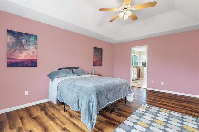 3912 Jacobs Lndg, Saint Charles, MO 63304 - bedroom featuring a tray ceiling, baseboards, wood finished floors, and a ceiling fan