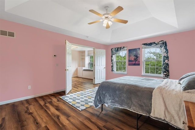 3912 Jacobs Lndg, Saint Charles, MO 63304 - bedroom with a tray ceiling, wood finished floors, baseboards, and a ceiling fan