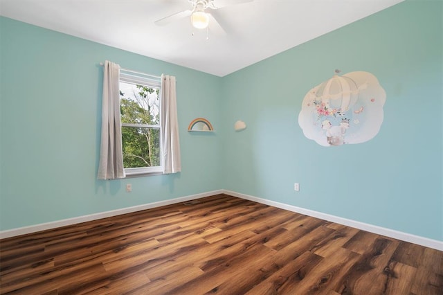 3912 Jacobs Lndg, Saint Charles, MO 63304 - unfurnished room with a ceiling fan, baseboards, and dark wood-type flooring