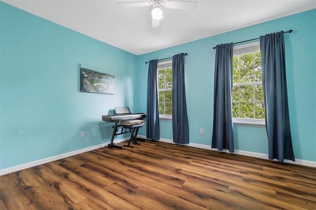 3912 Jacobs Lndg, Saint Charles, MO 63304 - unfurnished room featuring baseboards, dark wood-style floors, ceiling fan, and an office area