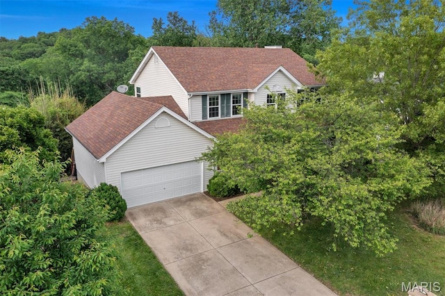 3912 Jacobs Lndg, Saint Charles, MO 63304 - view of front facade with concrete driveway, an attached garage, and a shingled roof