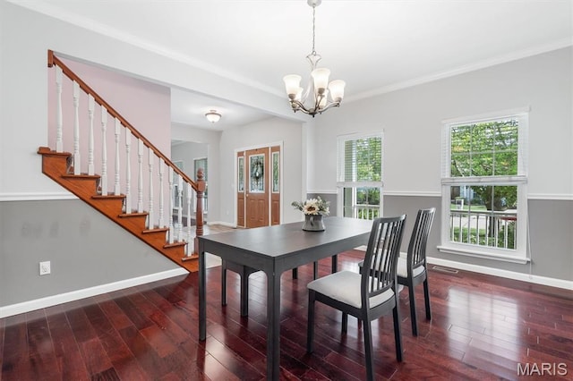 3912 Jacobs Lndg, Saint Charles, MO 63304 - dining space with a chandelier, wood finished floors, baseboards, stairway, and crown molding