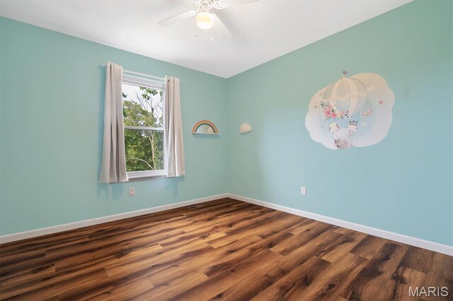 3912 Jacobs Lndg, Saint Charles, MO 63304 - spare room featuring ceiling fan, baseboards, and dark wood finished floors