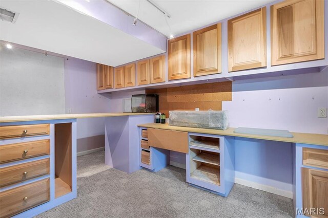 3912 Jacobs Lndg, Saint Charles, MO 63304 - unfurnished office with light colored carpet, rail lighting, built in desk, and baseboards