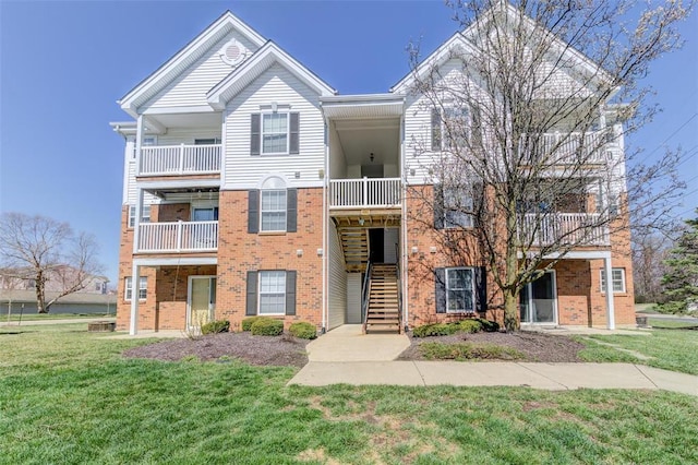 480 Benton Dr Unit L, Saint Peters, MO 63376 - view of property with brick siding, a front lawn, and stairway