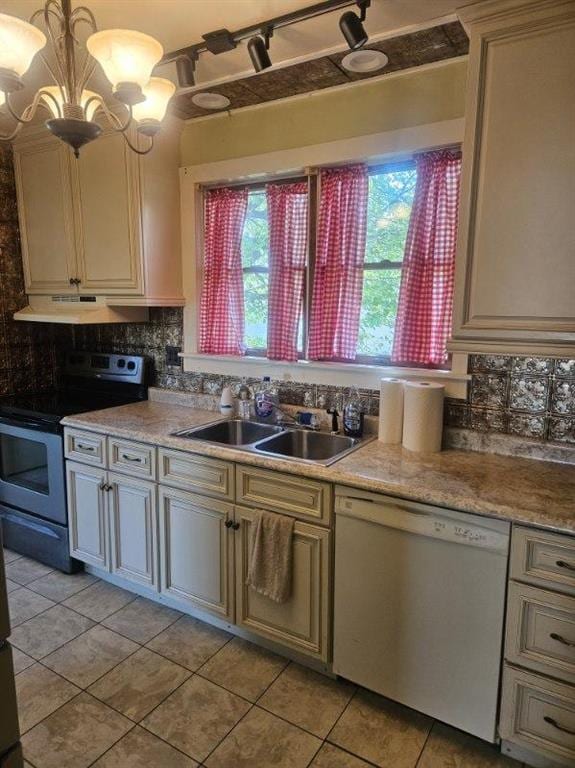 506 S Sparta St, Steeleville, IL 62288 - kitchen featuring stainless steel electric range oven, dishwashing machine, under cabinet range hood, a sink, and light tile patterned floors