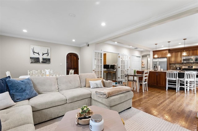 7520 Buckingham Dr Unit 1W, Saint Louis, MO 63105 - living room with arched walkways, recessed lighting, light wood-style flooring, and ornamental molding