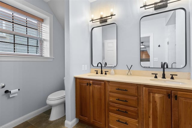 7520 Buckingham Dr Unit 1W, Saint Louis, MO 63105 - bathroom with toilet, double vanity, and baseboards