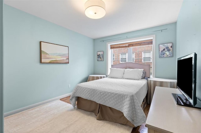 7520 Buckingham Dr Unit 1W, Saint Louis, MO 63105 - bedroom with wood finished floors and baseboards