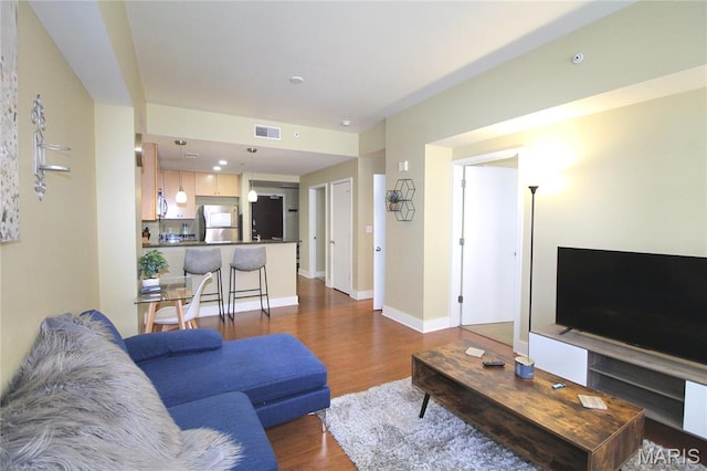 314 N Broadway Unit 603, Saint Louis, MO 63102 - living area with wood finished floors and baseboards