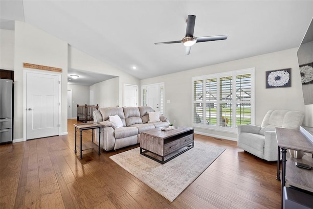 217 Arlington Dr, Moscow Mills, MO 63362 - living area featuring vaulted ceiling, dark wood-type flooring, ceiling fan, and baseboards