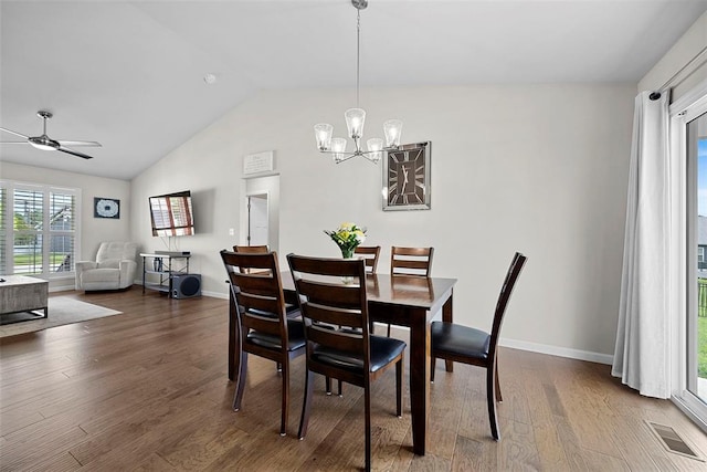 217 Arlington Dr, Moscow Mills, MO 63362 - dining space featuring a chandelier, wood finished floors, vaulted ceiling, a ceiling fan, and baseboards