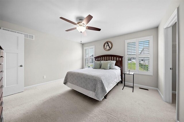 217 Arlington Dr, Moscow Mills, MO 63362 - bedroom with light carpet, baseboards, and ceiling fan