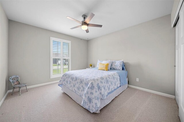 217 Arlington Dr, Moscow Mills, MO 63362 - bedroom featuring baseboards, light colored carpet, and ceiling fan