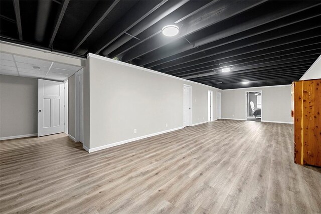 217 Arlington Dr, Moscow Mills, MO 63362 - finished below grade area featuring wood finished floors and baseboards