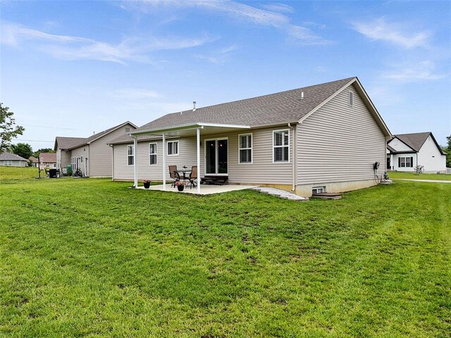 217 Arlington Dr, Moscow Mills, MO 63362 - back of house featuring a patio, a yard, and a shingled roof