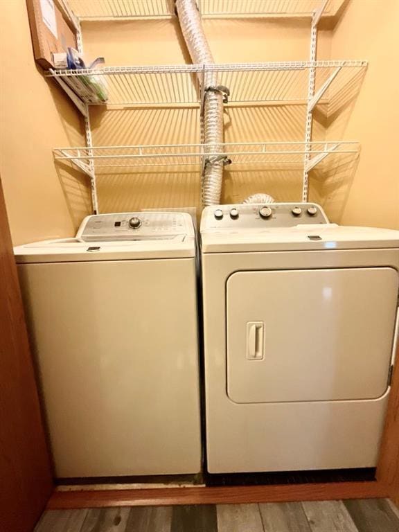 18318 Lakeview Cir Unit 606, Monroe City, MO 63456 - washroom with separate washer and dryer and wood finished floors