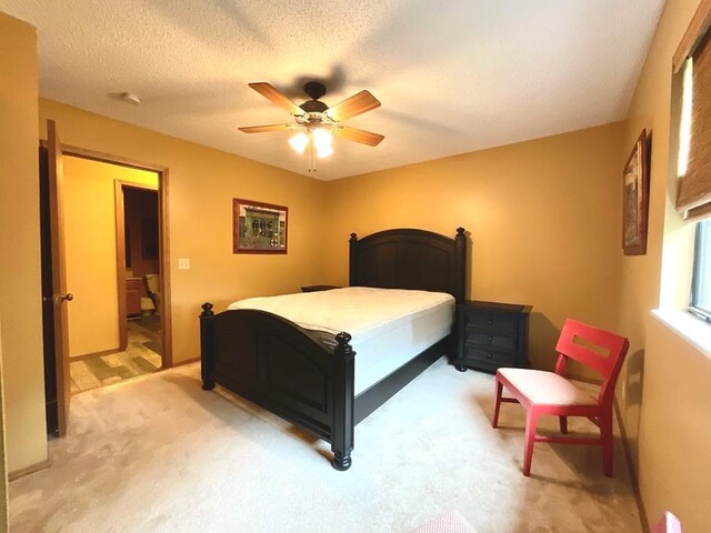 18318 Lakeview Cir Unit 606, Monroe City, MO 63456 - bedroom featuring light colored carpet, ceiling fan, and a textured ceiling