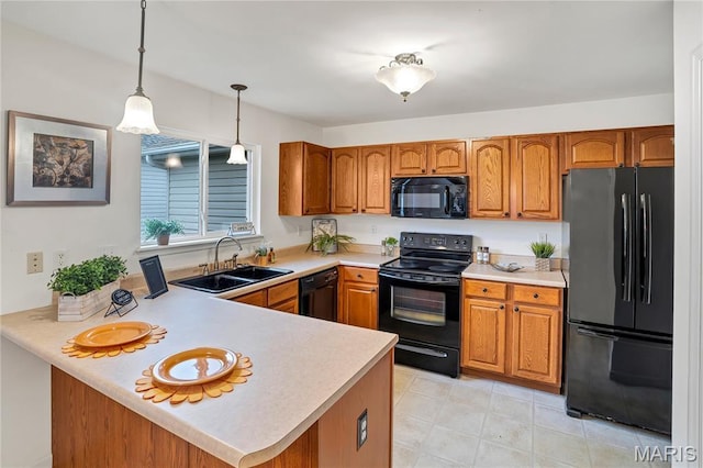 736 Berrywine Ln, Arnold, MO 63010 - kitchen featuring black appliances, brown cabinetry, light countertops, decorative light fixtures, and a peninsula