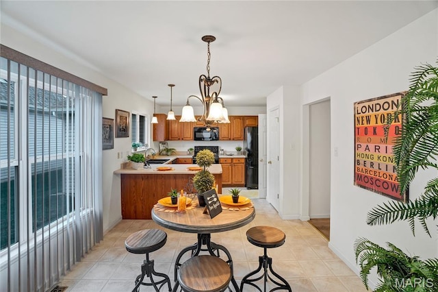 736 Berrywine Ln, Arnold, MO 63010 - dining room featuring a chandelier and light tile patterned flooring