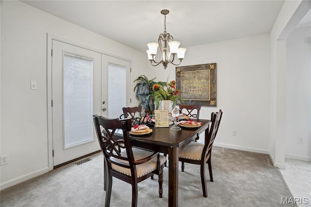 736 Berrywine Ln, Arnold, MO 63010 - dining room featuring a chandelier, light colored carpet, and french doors