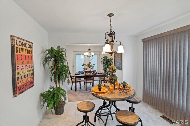 736 Berrywine Ln, Arnold, MO 63010 - dining room featuring light tile patterned floors and a chandelier