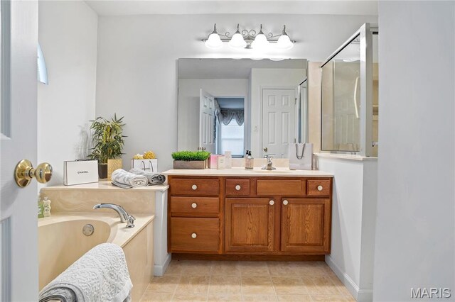 736 Berrywine Ln, Arnold, MO 63010 - bathroom featuring vanity, a garden tub, a shower with shower door, and tile patterned floors