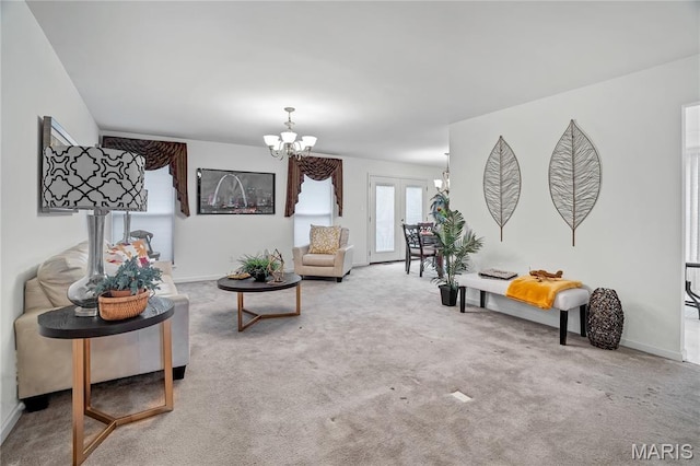 736 Berrywine Ln, Arnold, MO 63010 - living room with a chandelier, carpet floors, and french doors