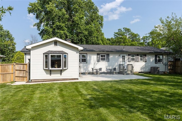 811 Bray Ave, Rolla, MO 65401 - back of house featuring a gate, a patio, and central AC