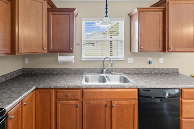 kitchen featuring black dishwasher, a sink, brown cabinets, and pendant lighting