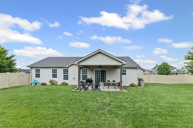 rear view of house featuring ceiling fan, a patio area, a gate, and roof with shingles
