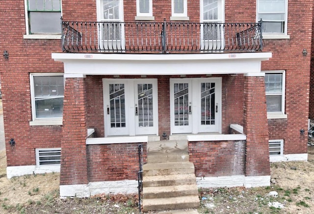 5027 S Broadway Ave Unit 1-4, Saint Louis, MO 63111 - doorway to property with french doors, a balcony, and brick siding